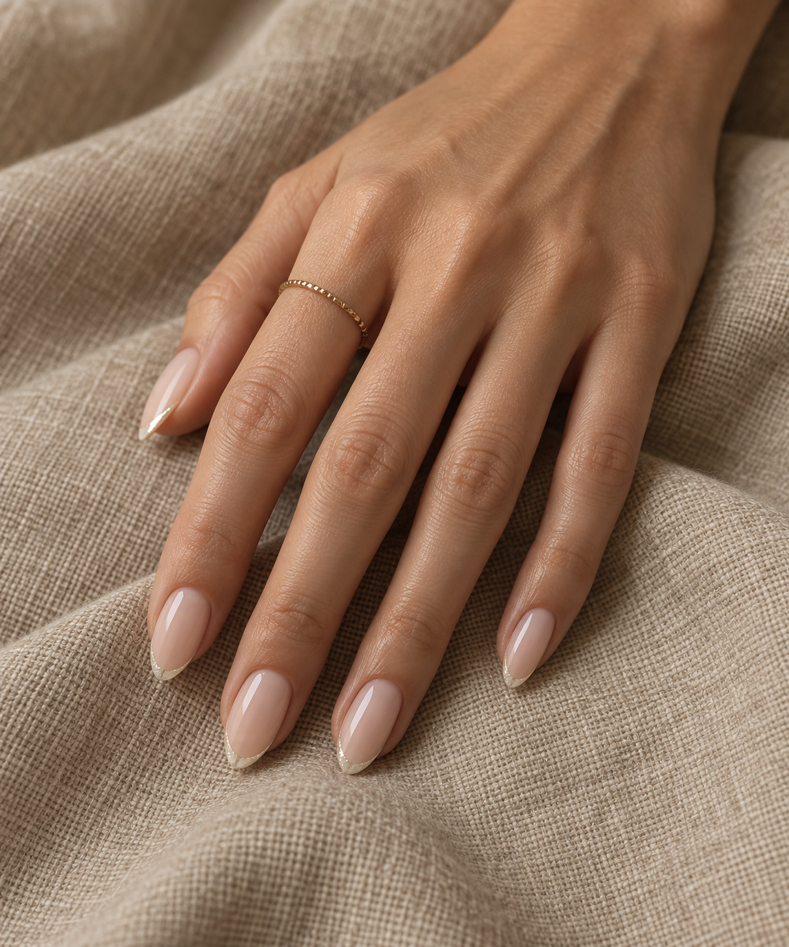 Old money rich girl nails on soft almond canvas with sheer warm oat glaze and whisper-thin micro-pearl tip line